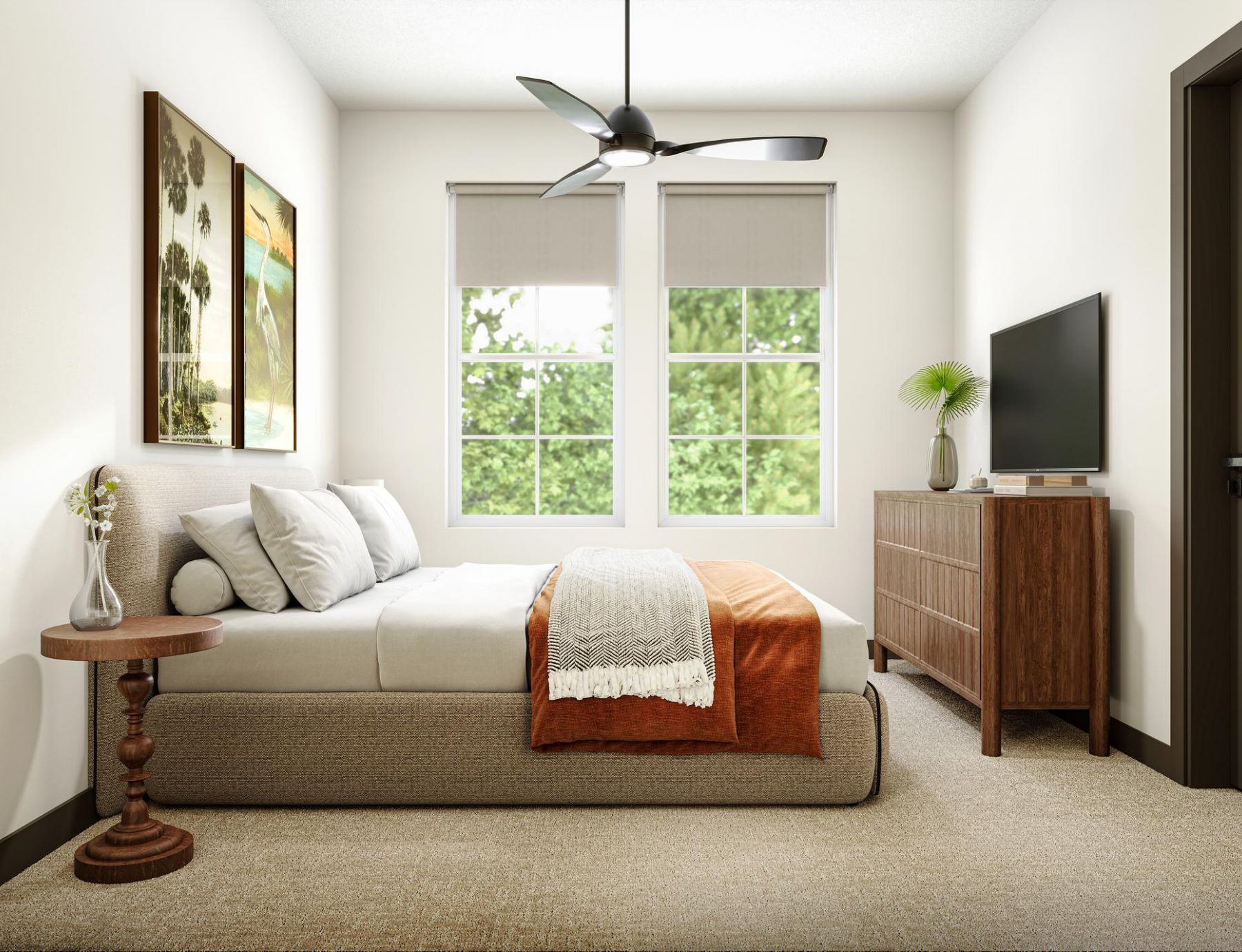 Modern bedroom with a bed, orange blanket, wooden dresser, TV, and two large windows with greenery outside.