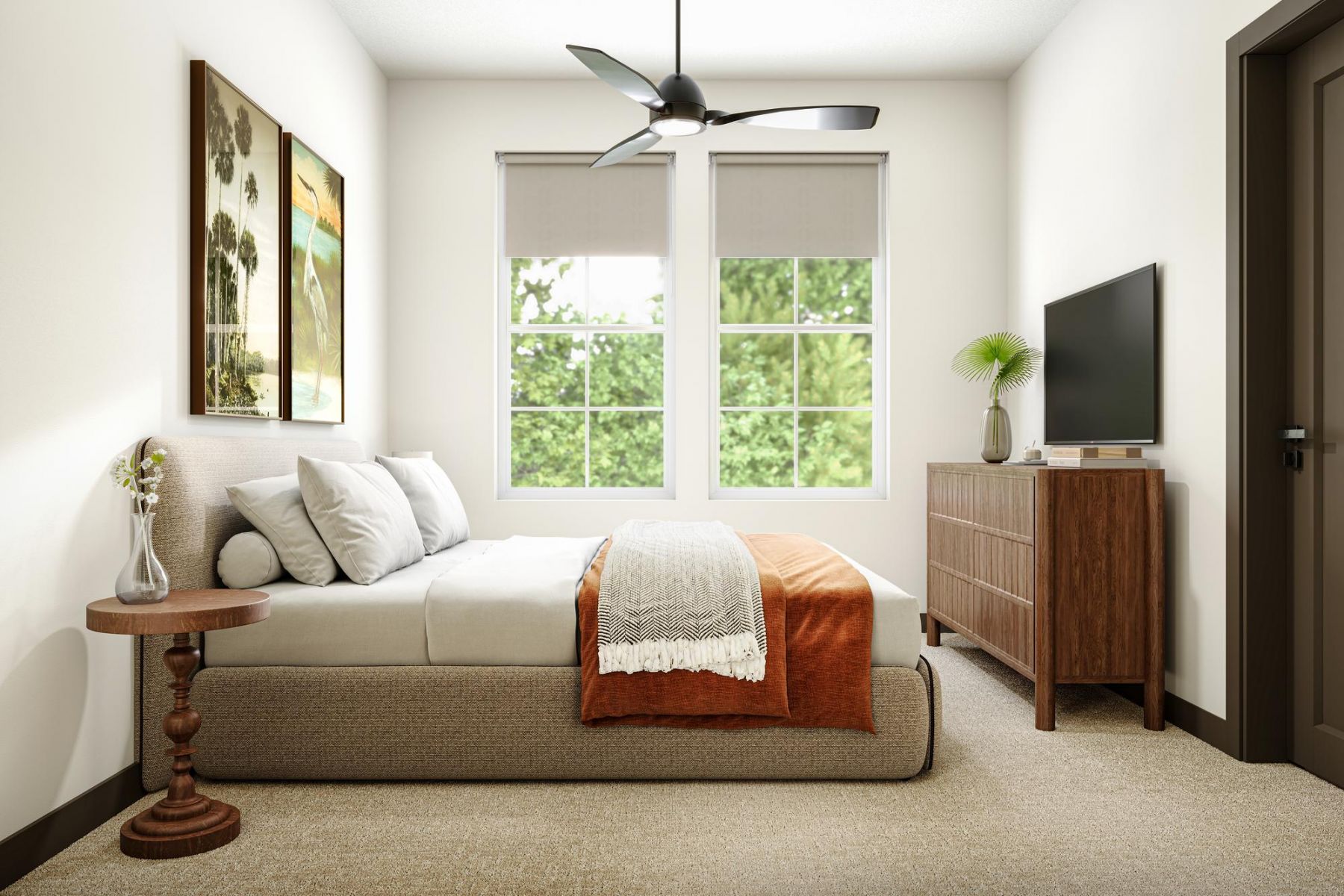 Modern bedroom with a bed, orange blanket, wooden dresser, TV, and two large windows with greenery outside.