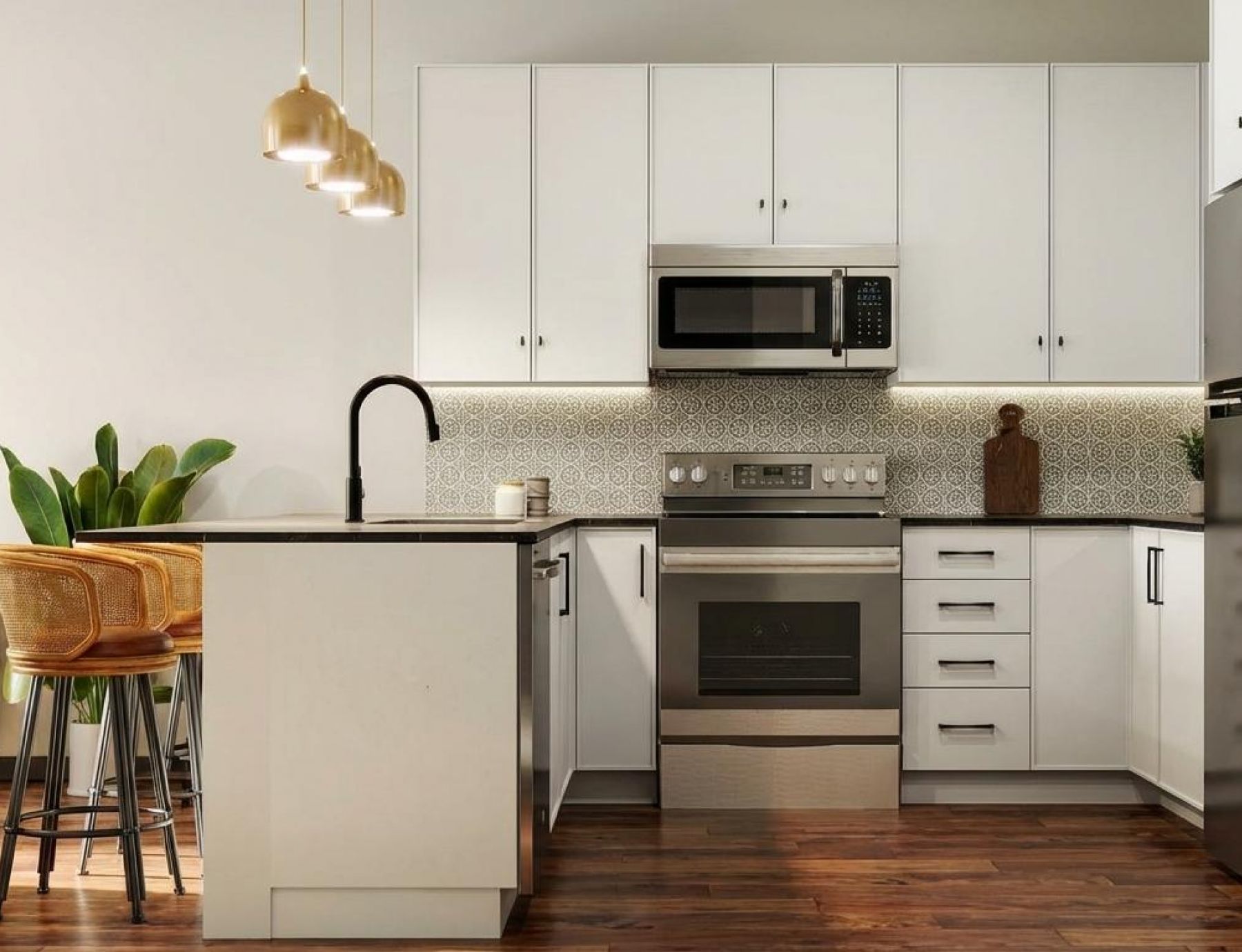 Modern kitchen with white cabinets, island, pendant lights, and stainless steel appliances.