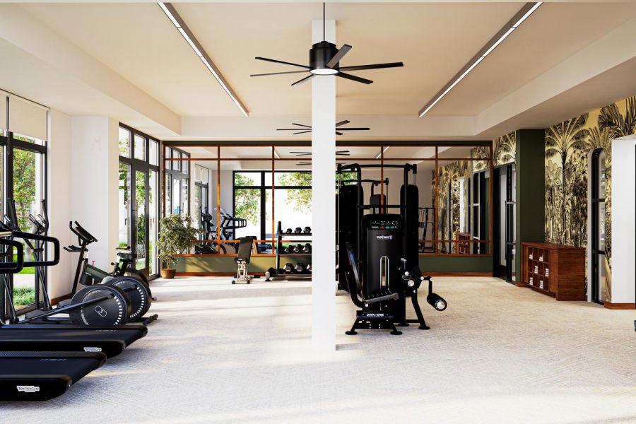 Modern gym with treadmills, exercise bikes, weight machines, large windows, and tropical wall mural.